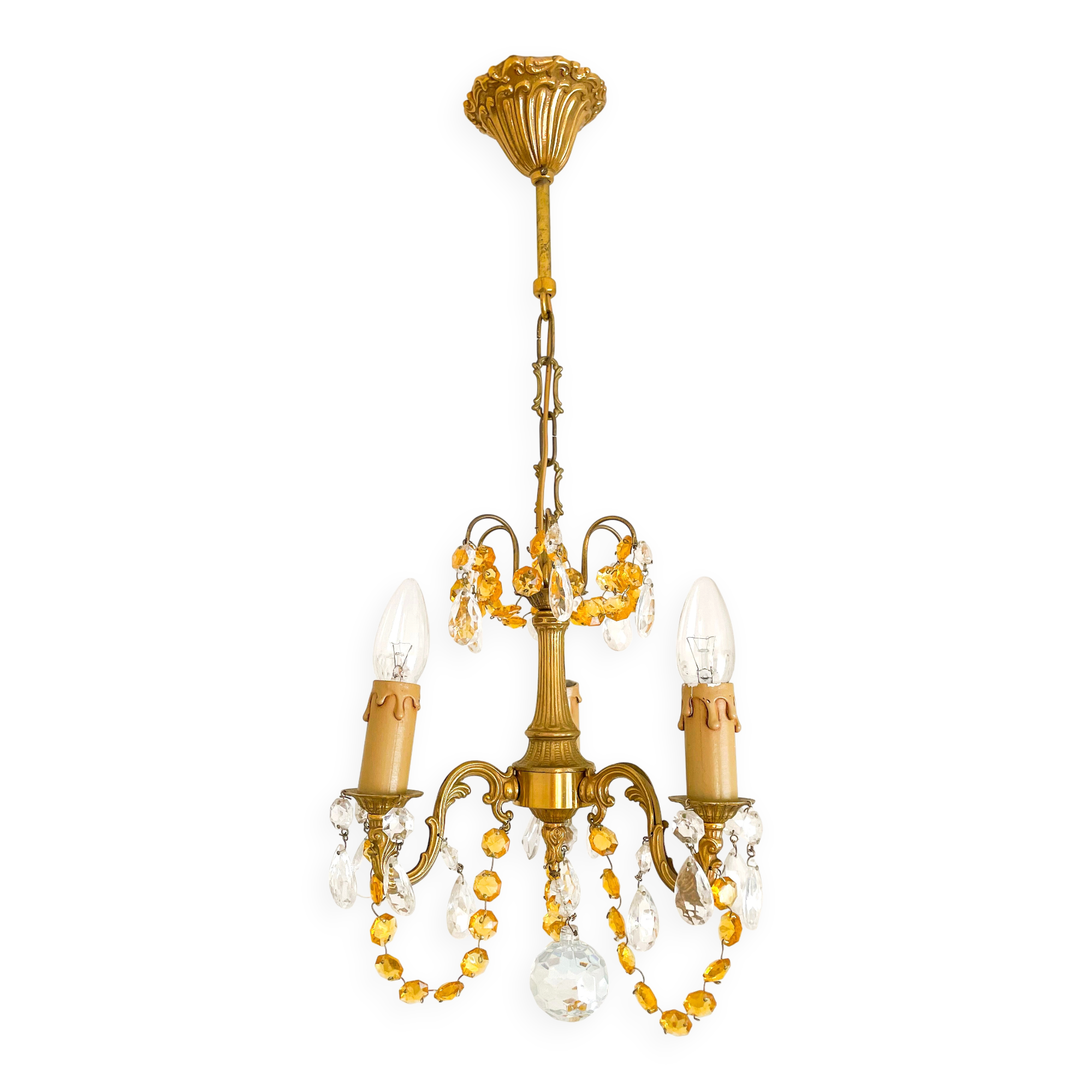Small vintage brass chandelier with amber crystal pendants.