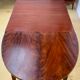 Table ovale en acajou style Empire