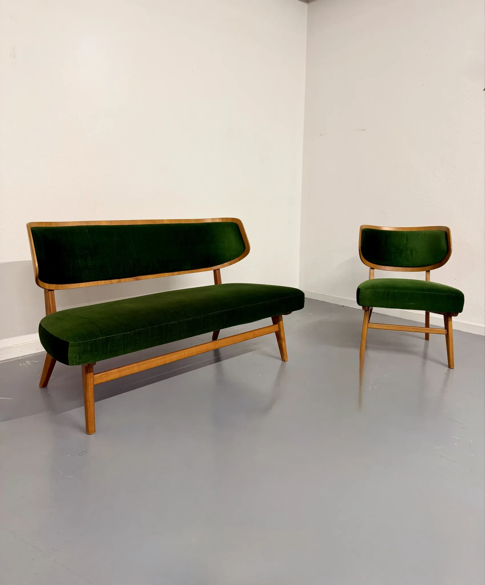 Sofa and armchair designed by Herta-Maria Witzemann, moulded wood, 1960s.