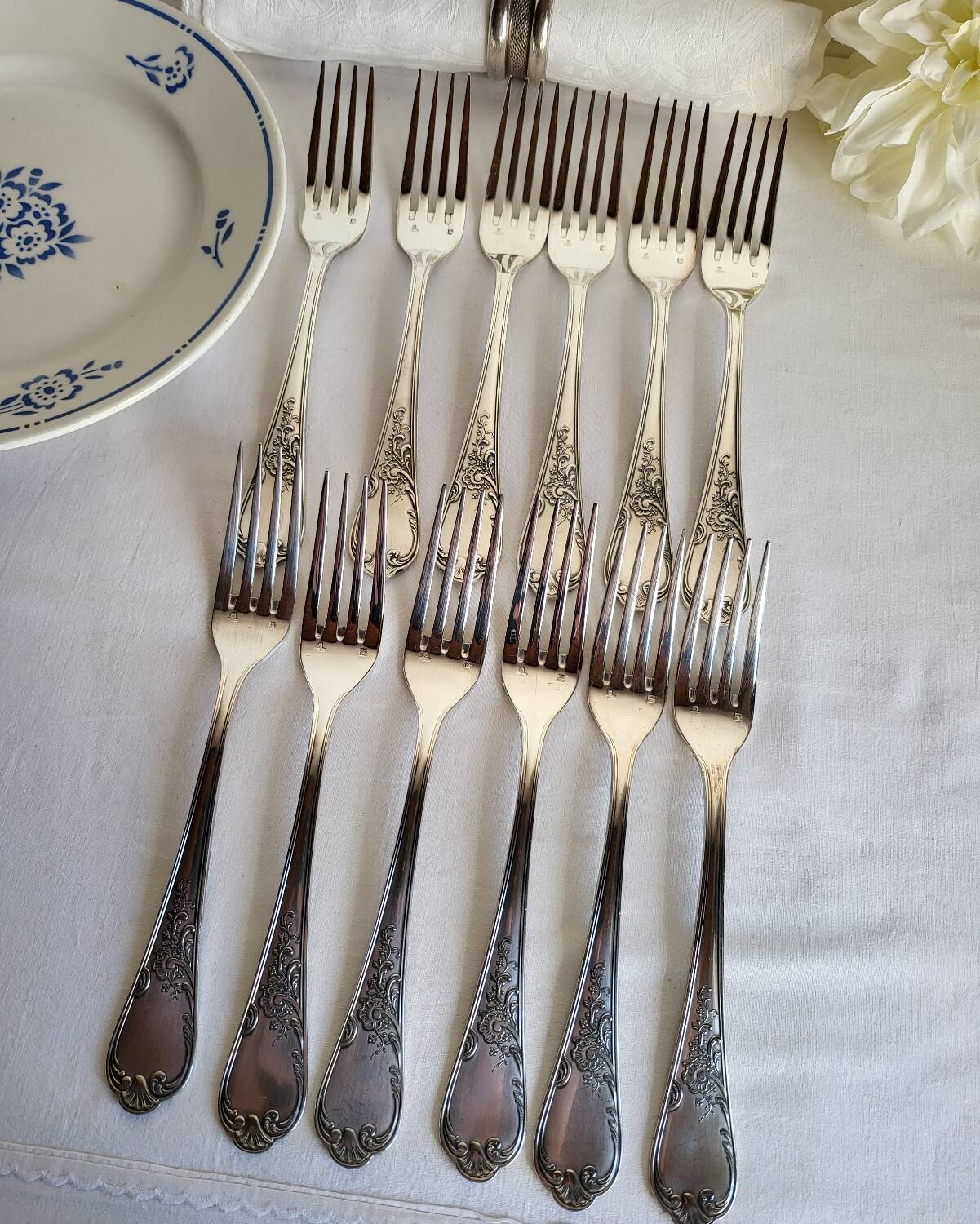 12 large silver-plated metal table forks by Guildart