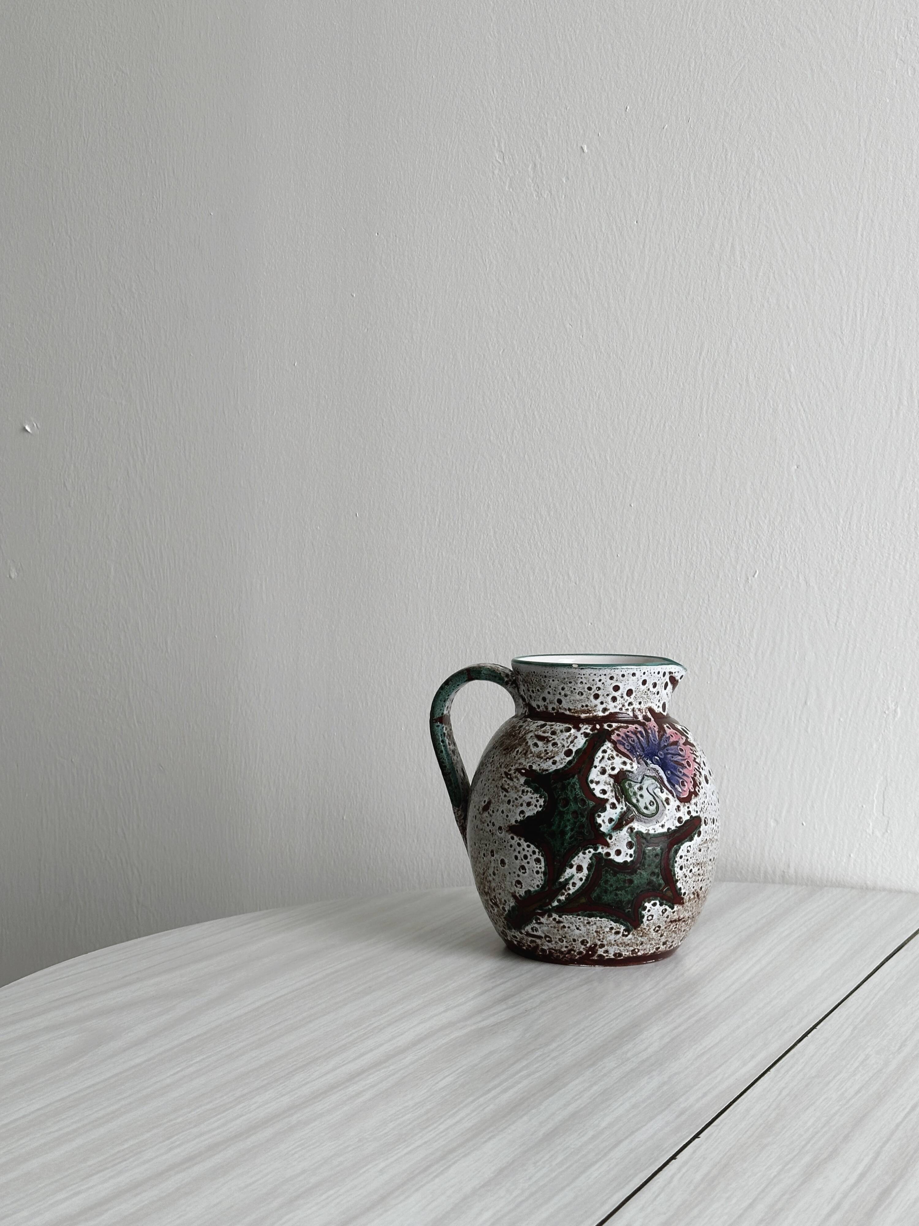 Antique decorative ceramic pitcher