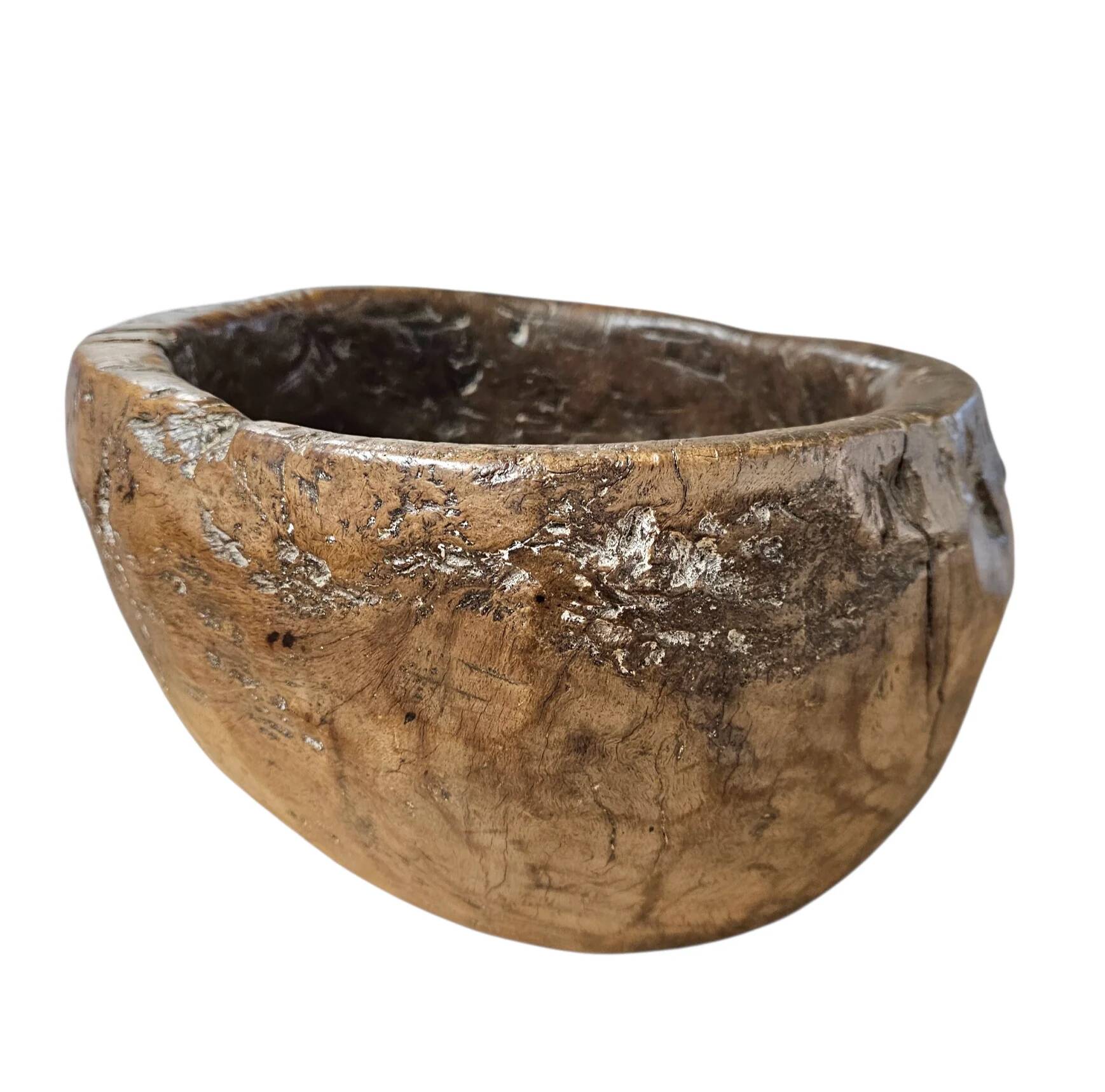 A substantial hand-hewn wooden bowl carved from a single burl section