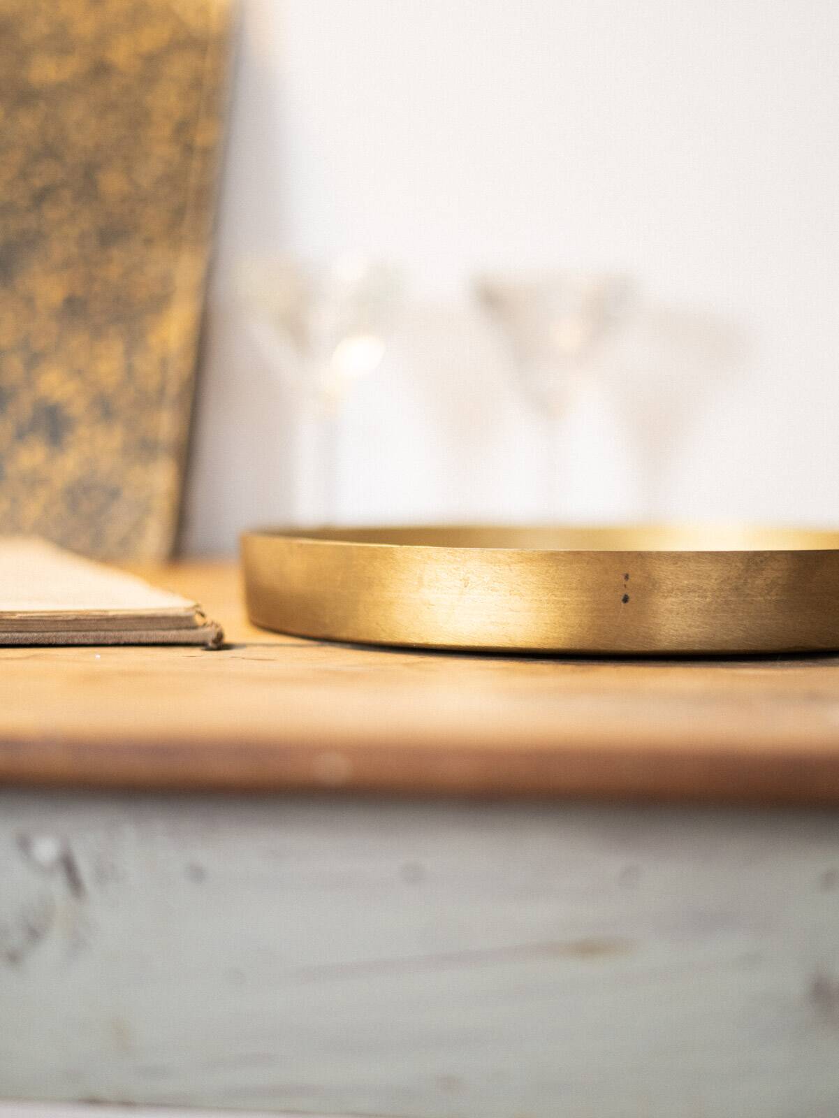 Patinated mirrored top and brass