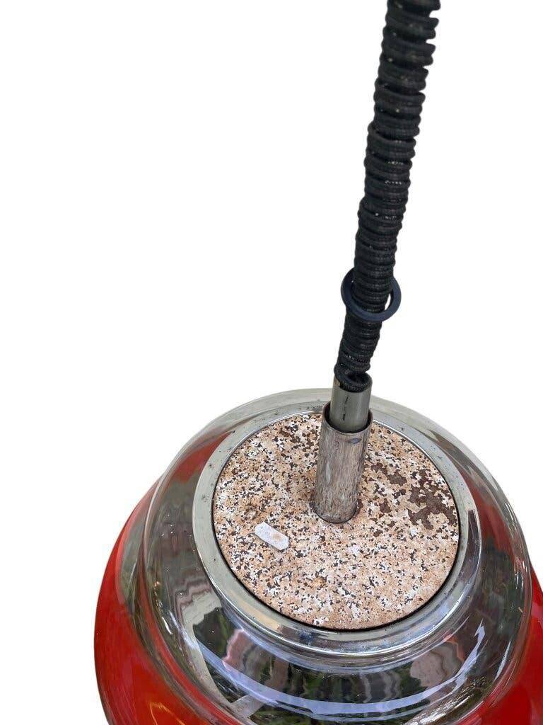 Vintage Murano glass pendant light with orange accent.