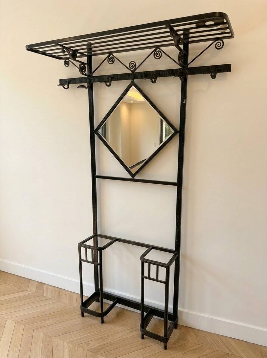 Antique black wrought iron coat rack with mirror.