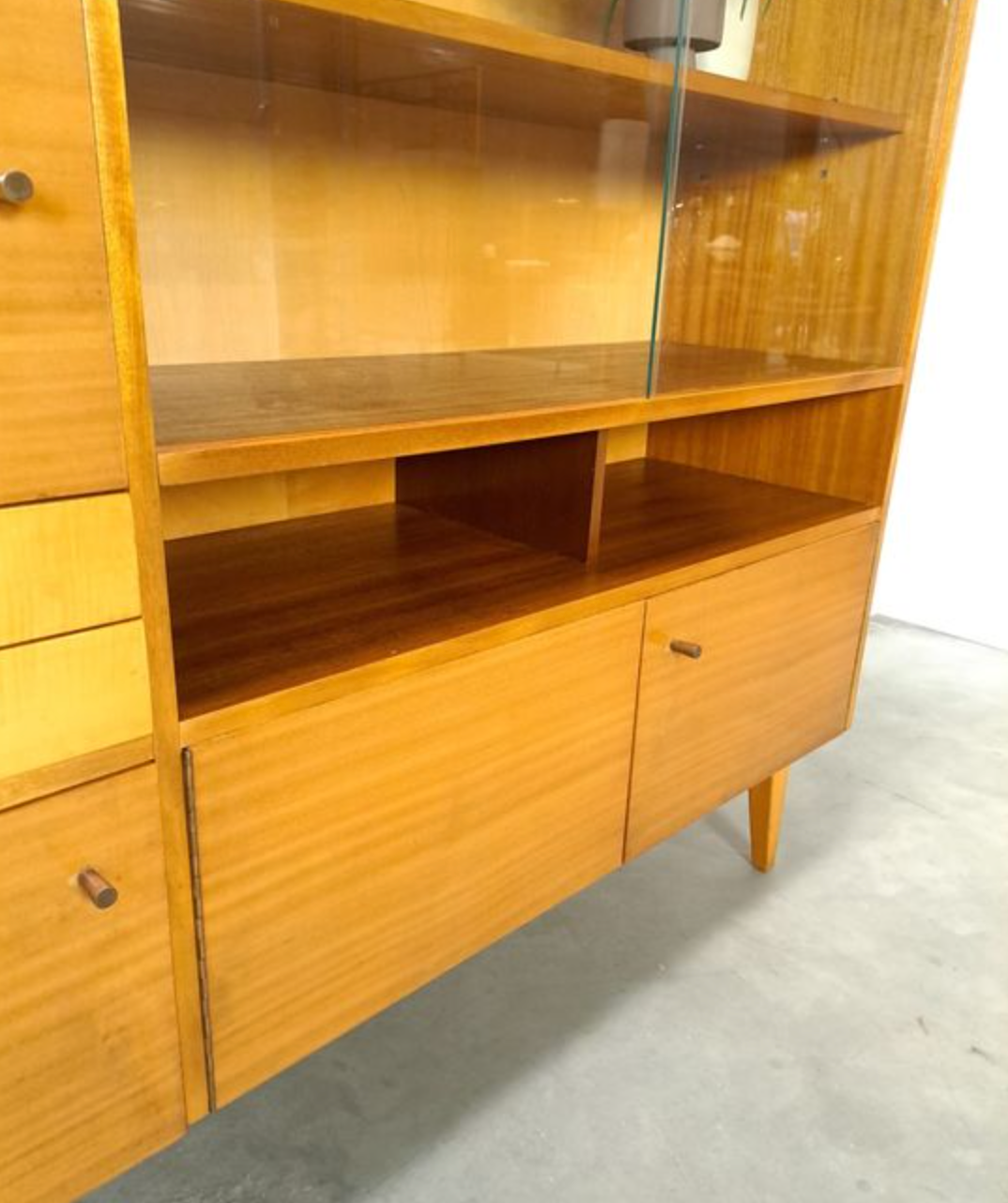 Vintage wooden sideboard with sliding glass doors and drawers