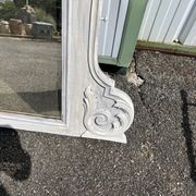 Large decorative mirror in carved wood with shabby patina