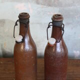 Set of 2 sandstone bottles with ceramic capsule