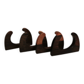 Four beautiful napkin holders in rosewood and teak.