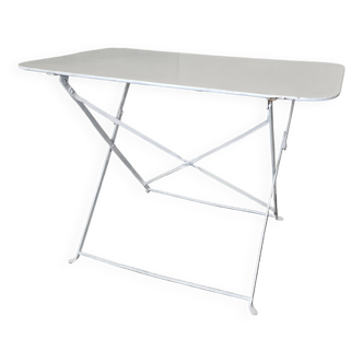 Ancienne table de jardin pliante en fer forgé