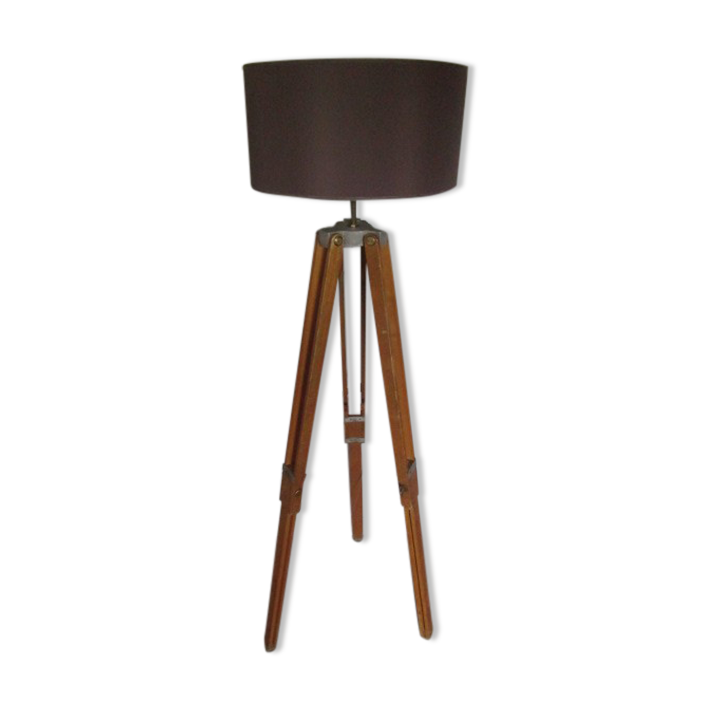 Old floor lamp on surveyor tripod