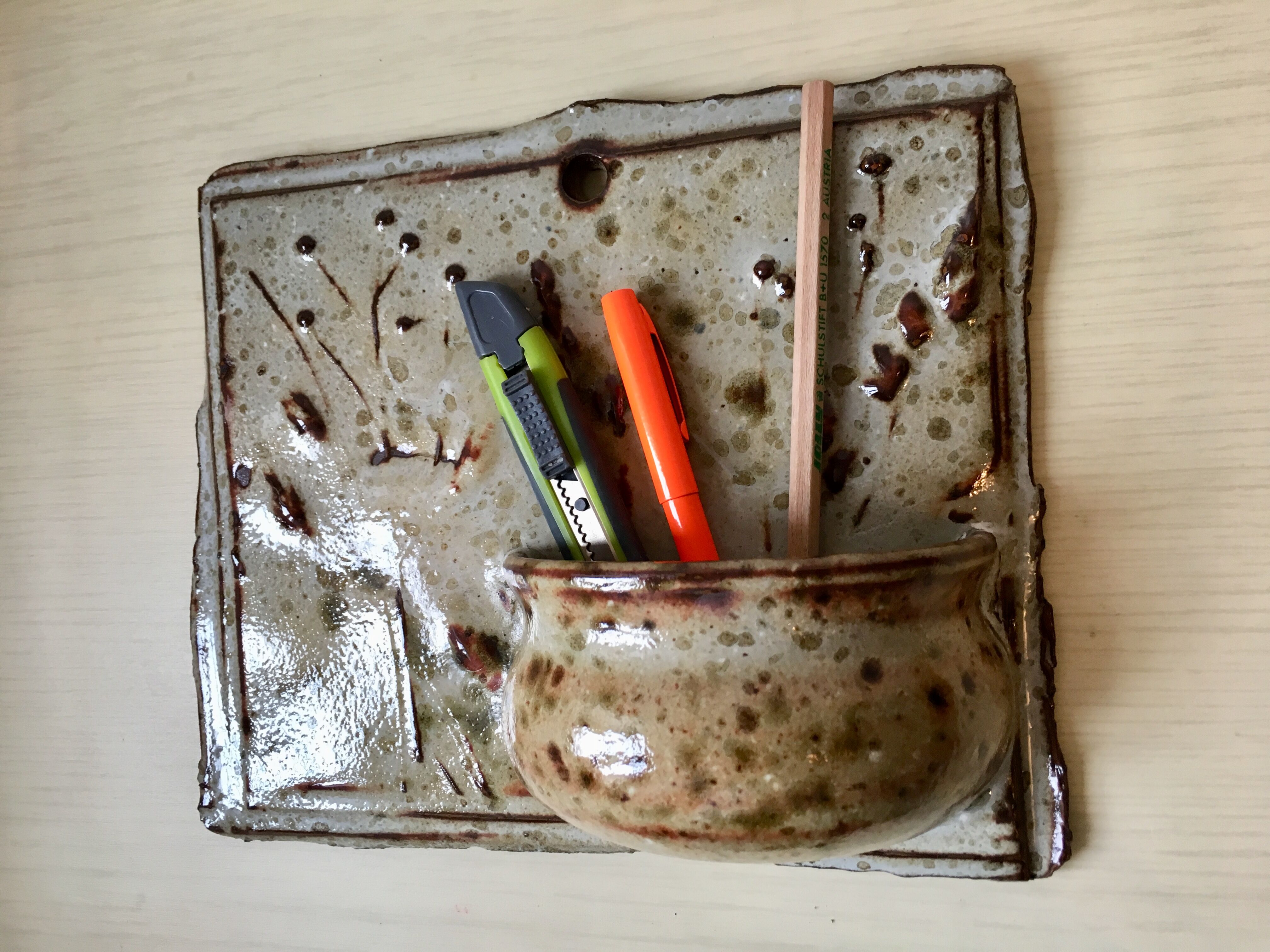 Enamelled sandstone wall flower pot