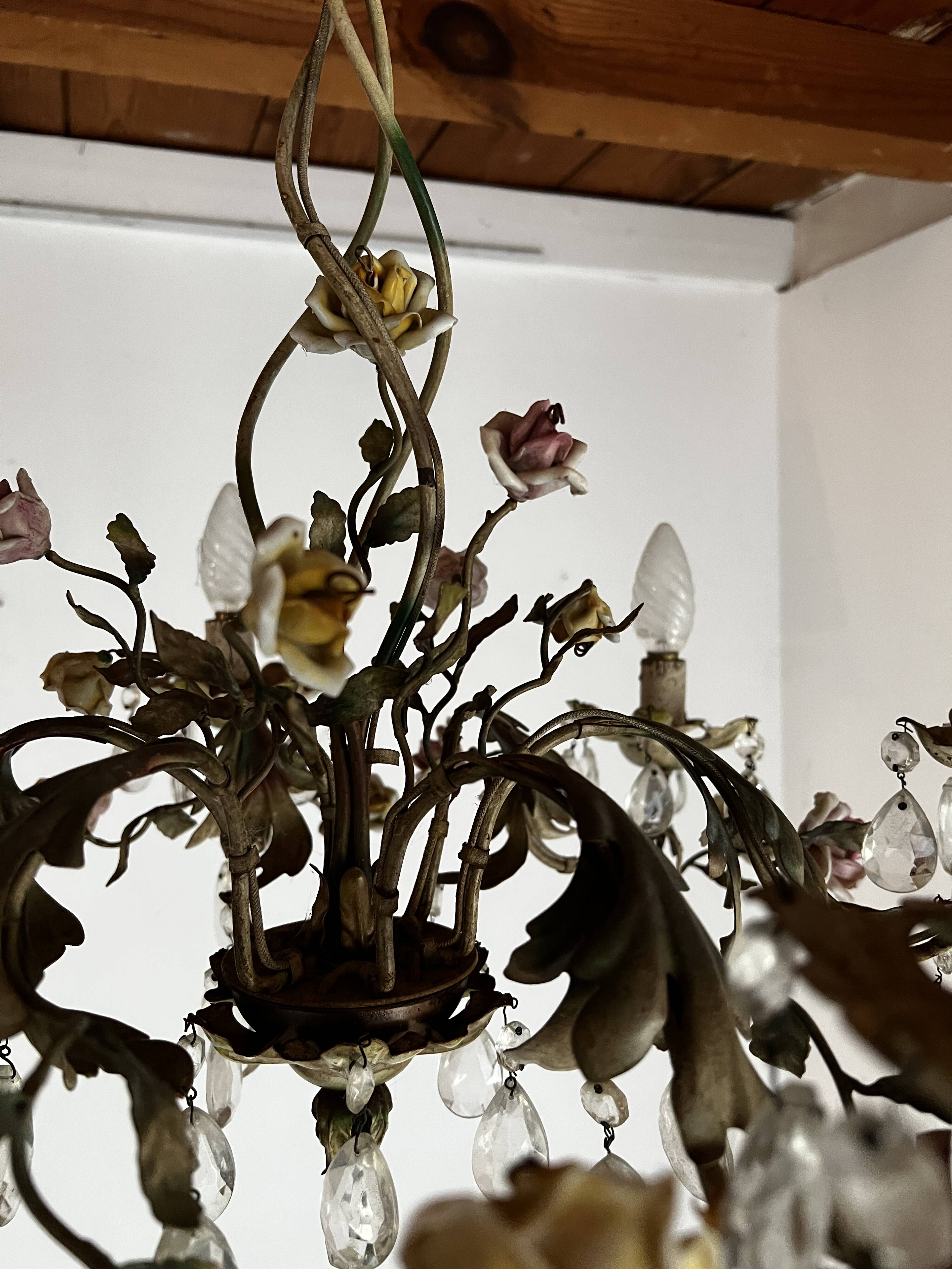 Chandelier with a floral porcelain decoration and pendants