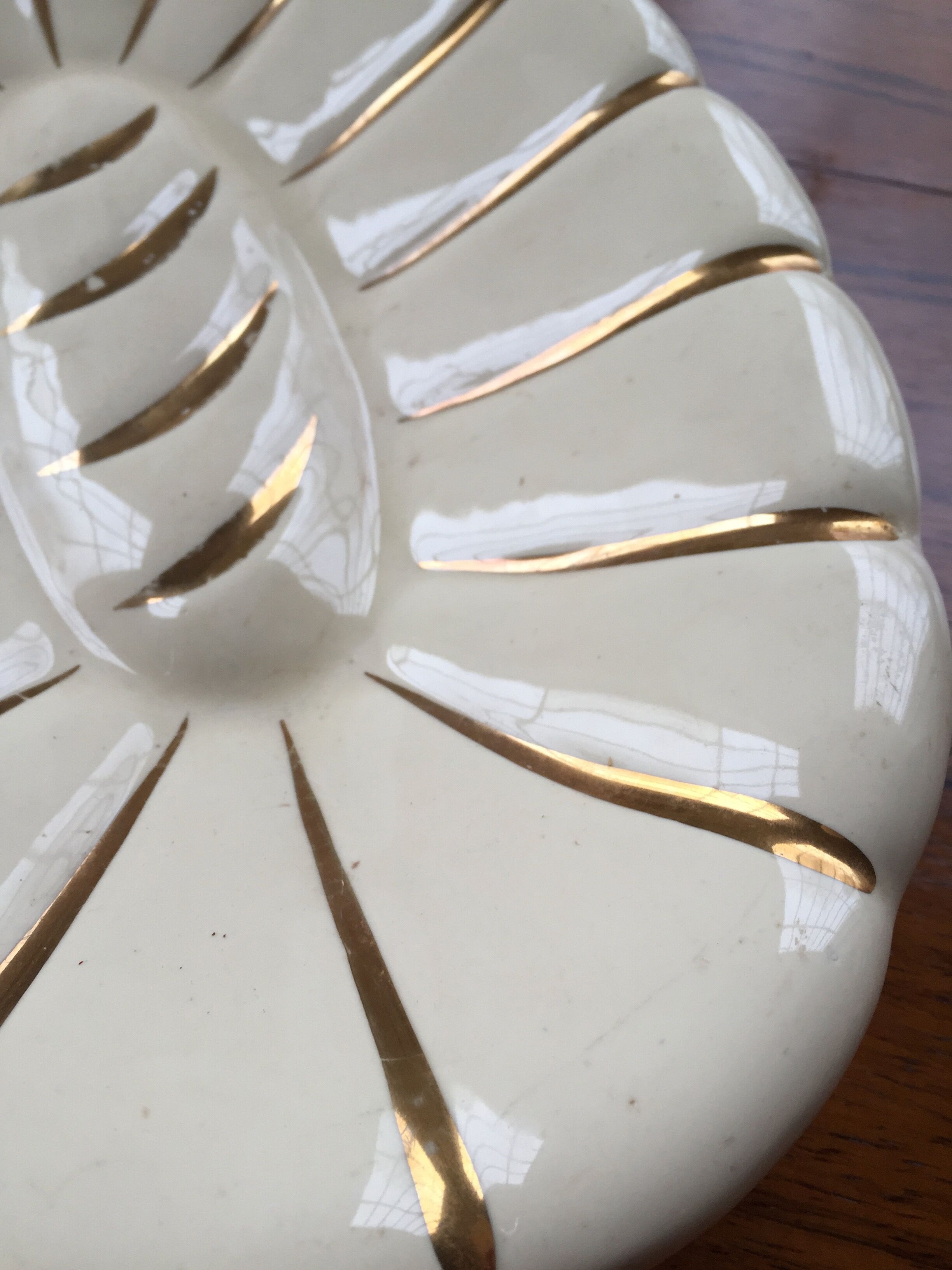 White and gold ceramic plate