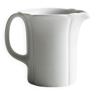 White porcelain milk jug, elegant design.