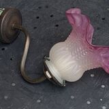 Metal wall lamp with frosted glass shade in the shape of a pink corolla