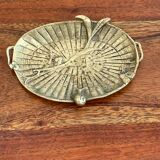 Empty brass snail pocket