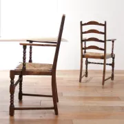 Pair of English oak armchairs with ladder back and rush seats