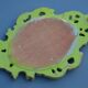 Small green wooden mirror