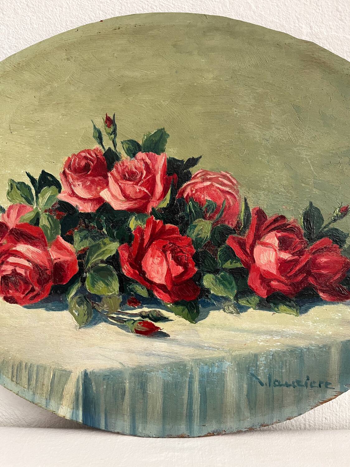 Old oil painting on oval wood with roses thrown from the 30s