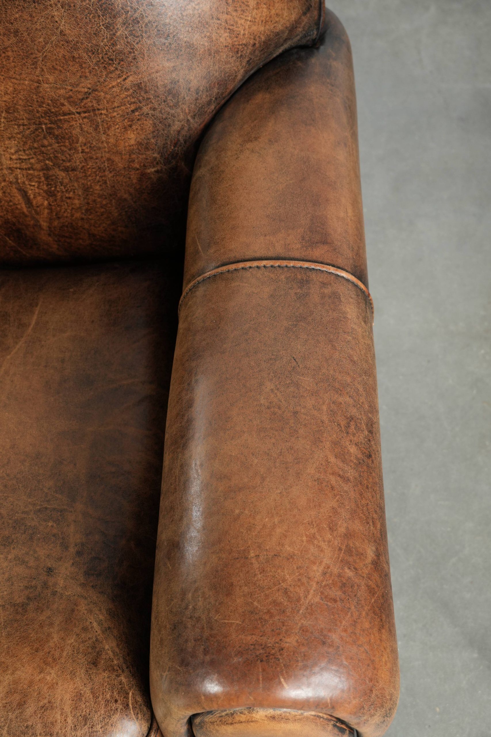 Set of two sheepskin Art Deco design armchairs with beautiful patina