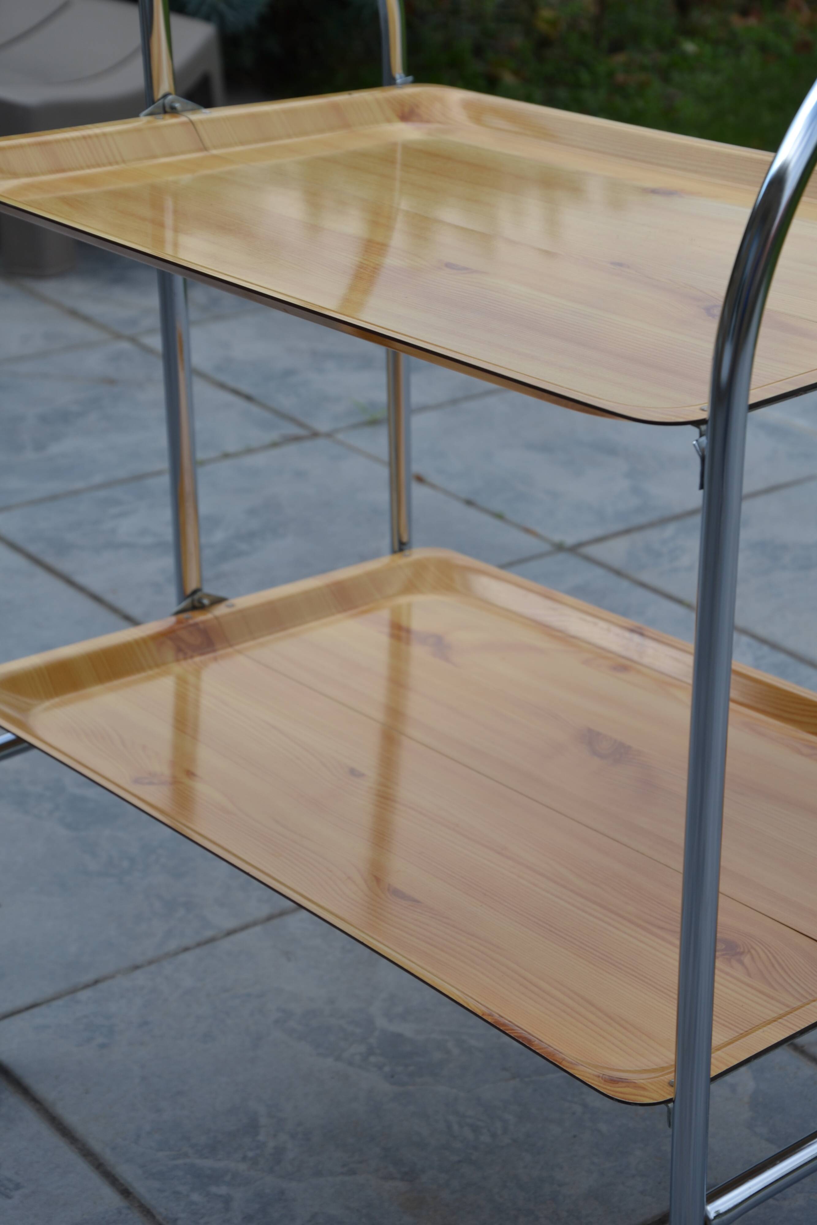 Folding dessert trolley on chrome metal wheels and formica.