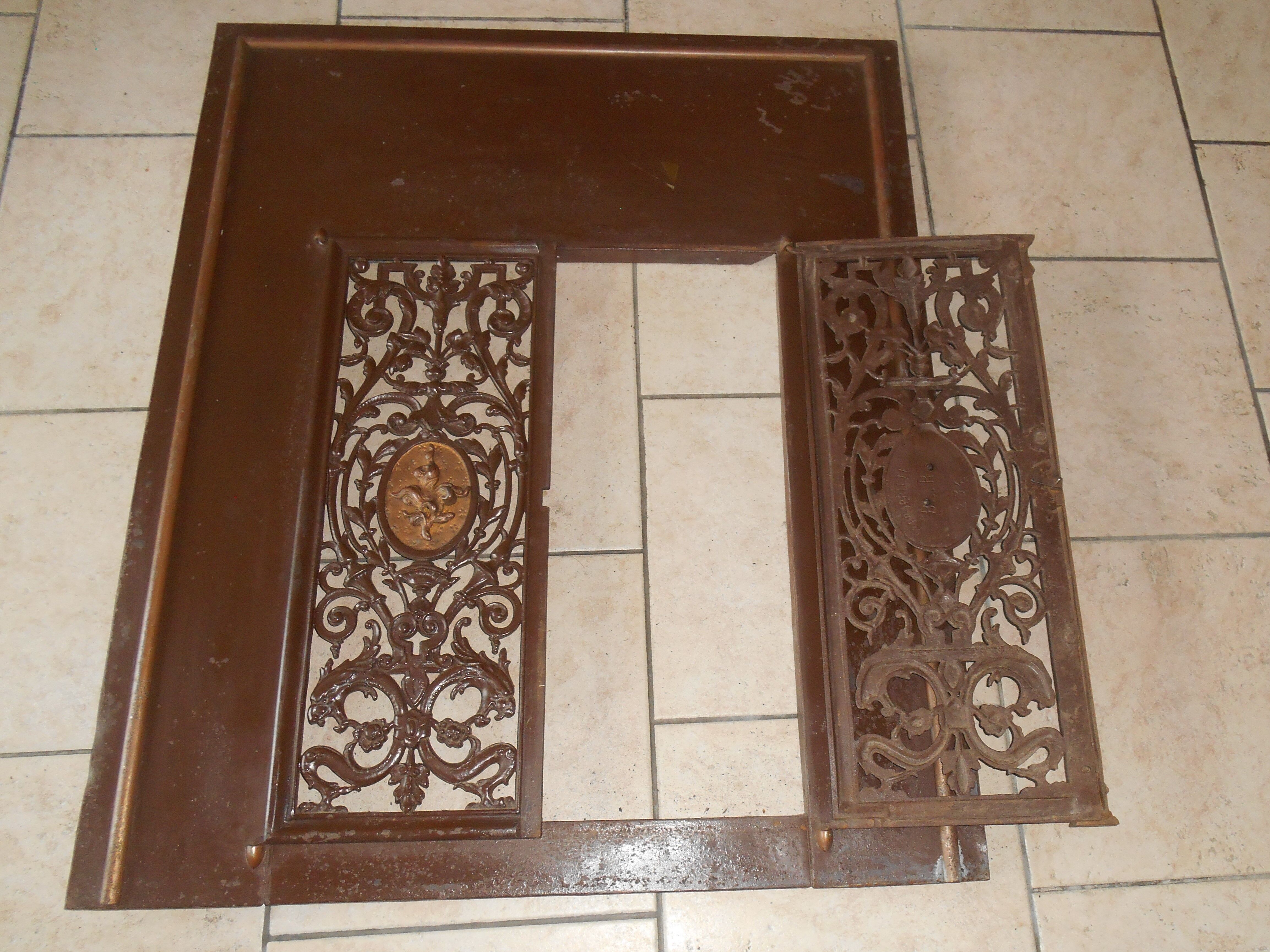 Pair of cast iron door grilles with its coat