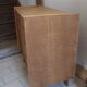 Commode aux pieds compas en bois brut