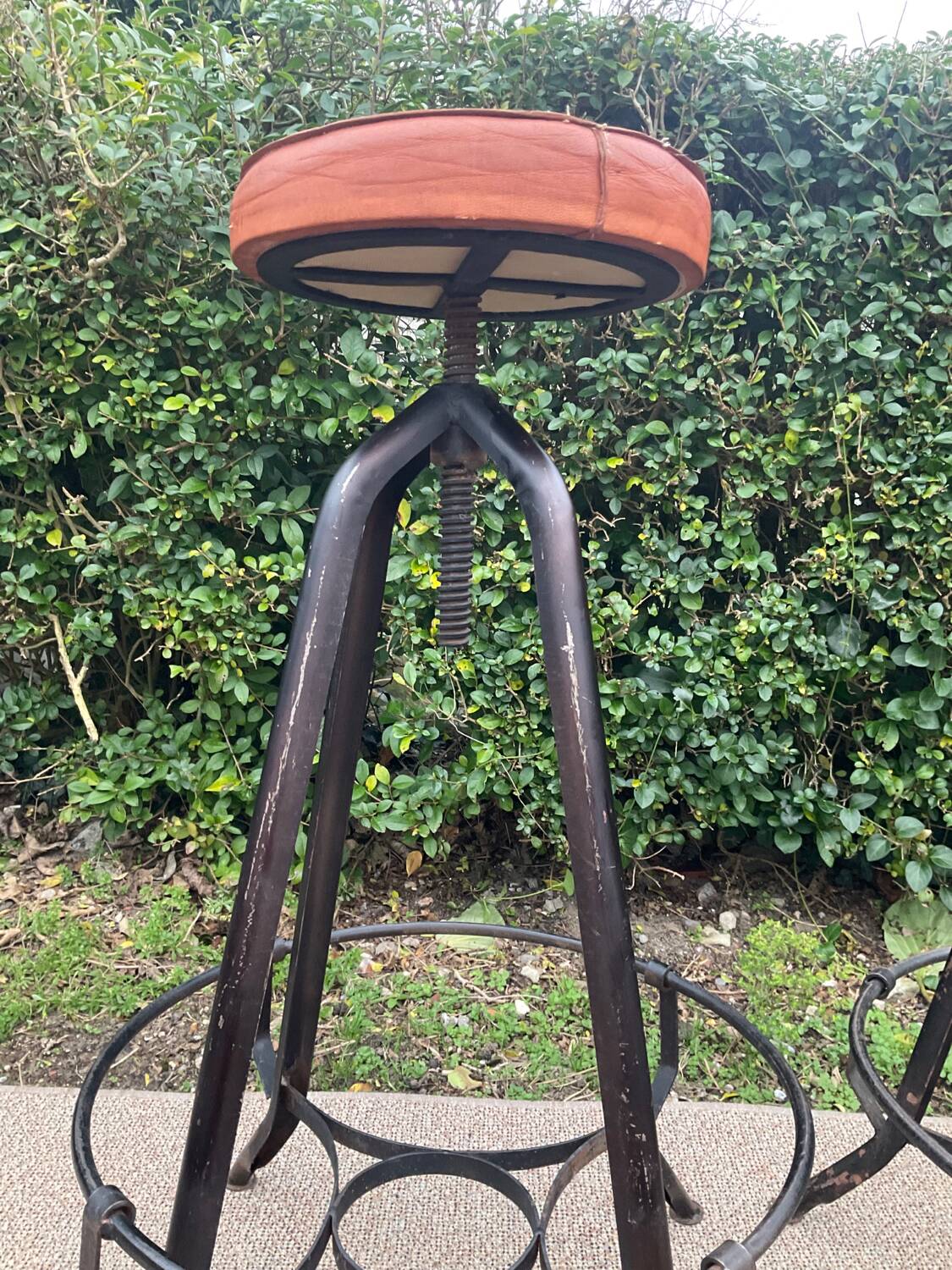 Pair of vintage metal and leather bar stools