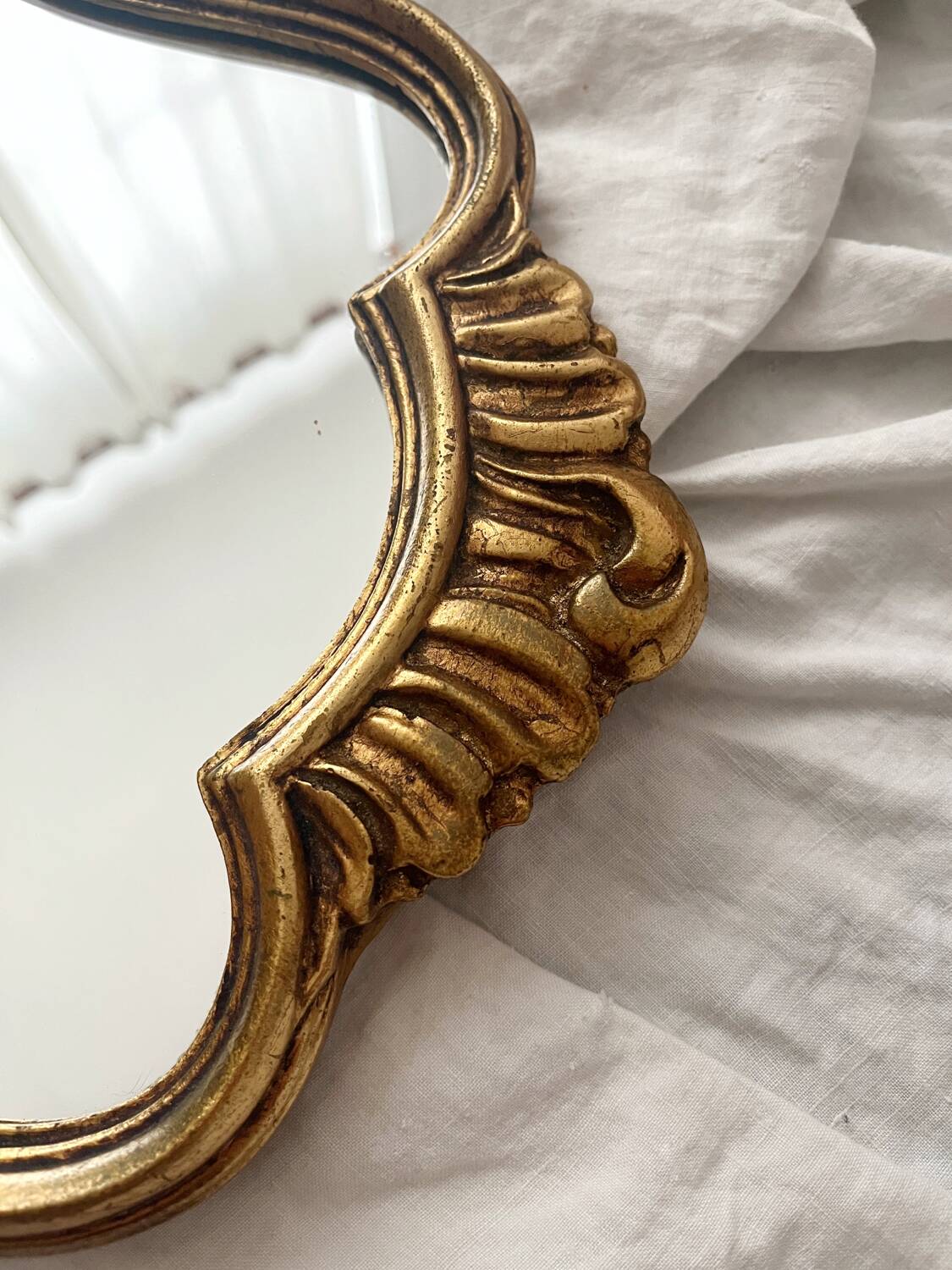Antique Louis XV gilded mirror with vintage rocaille shell
