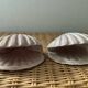 Duo of N shell-shaped towel holders in glazed ceramic
