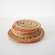 Set of coasters and bottles in colored wicker