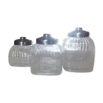three large glass jars