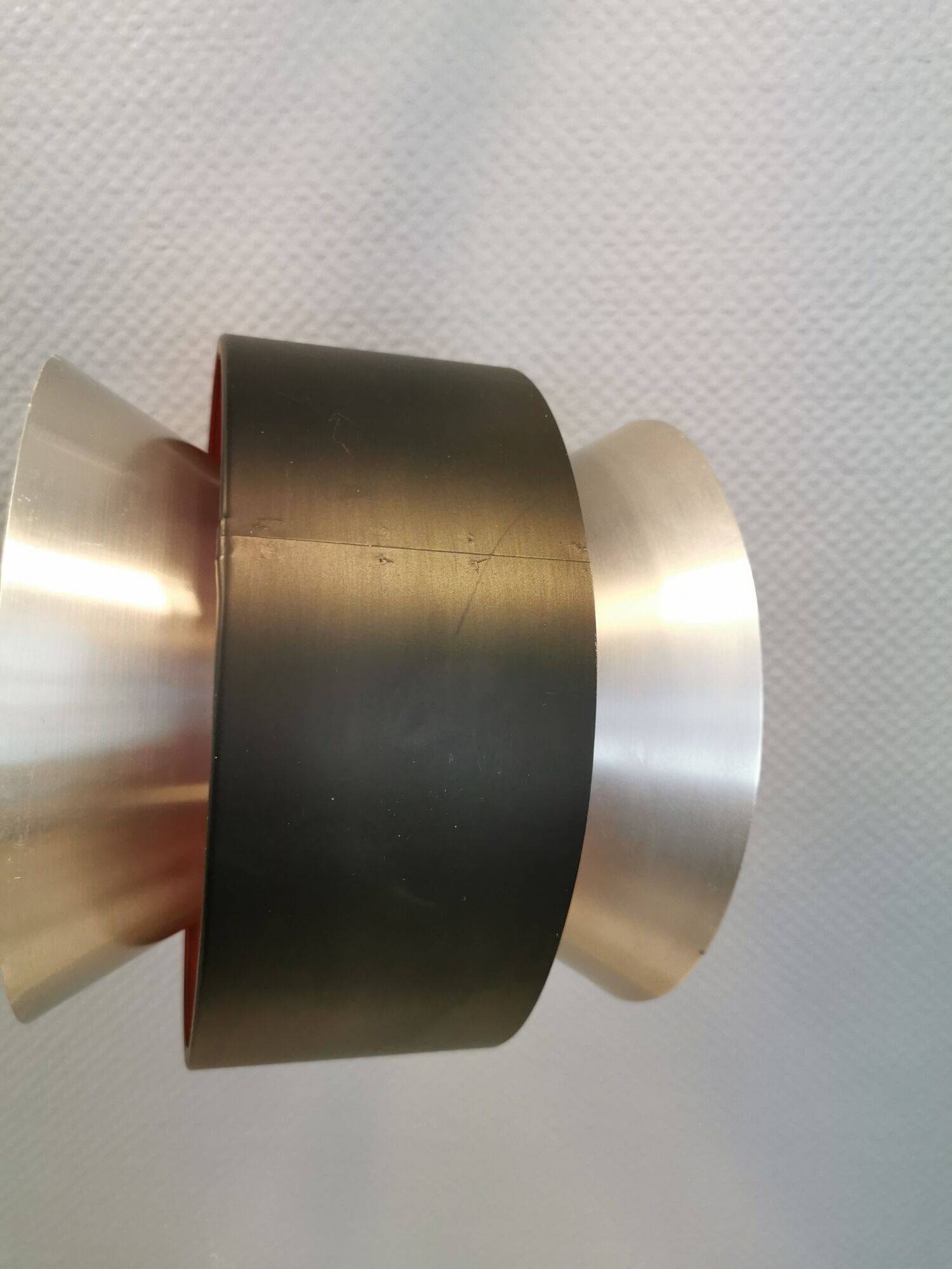 Hanging lamp,  of silver coloured aluminium with black "ring" and orange inner contrast lacquer.