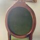 Antique wooden and velvet upholstered chair