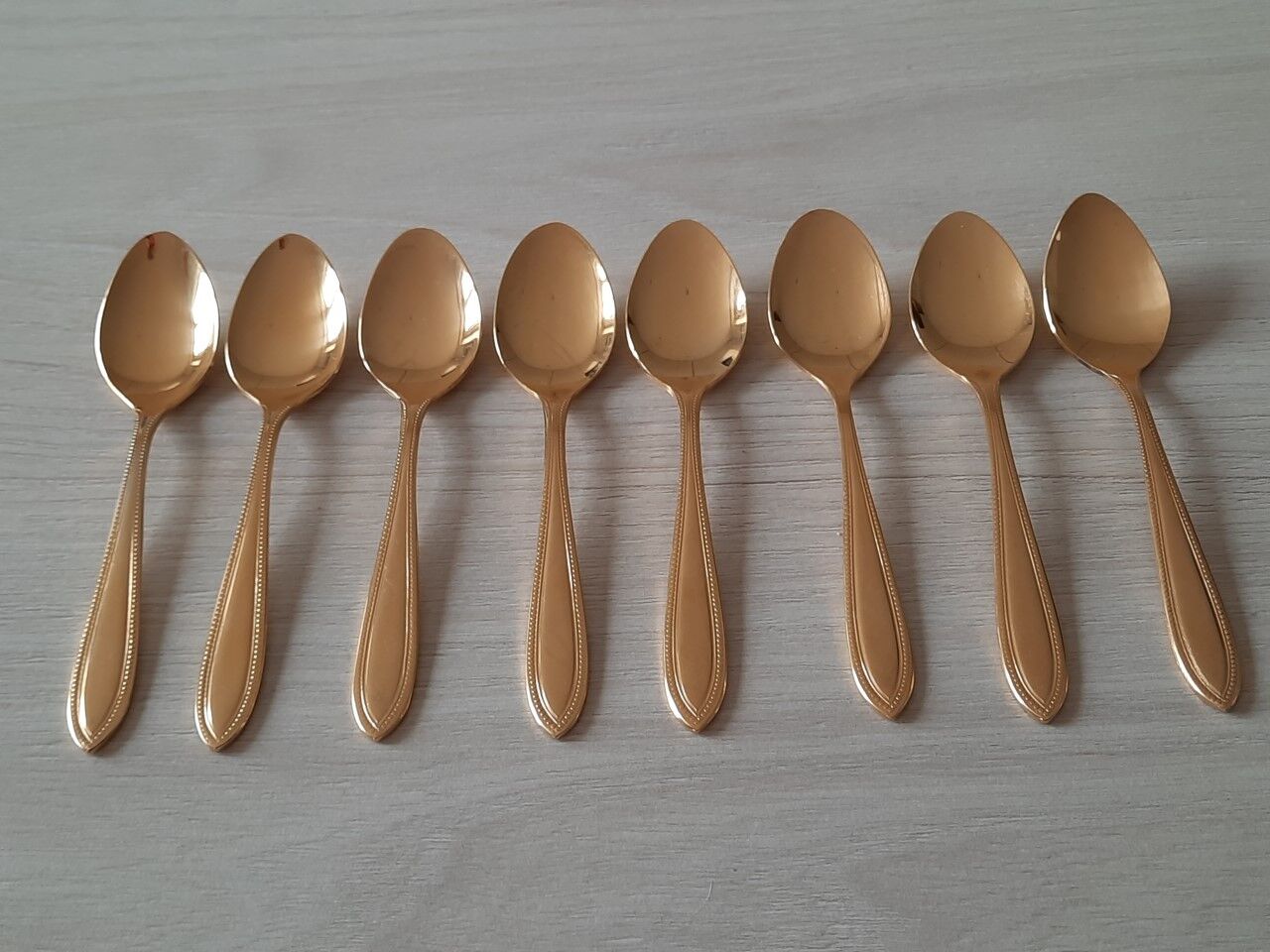 Small golden metal spoons
