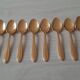 Small golden metal spoons