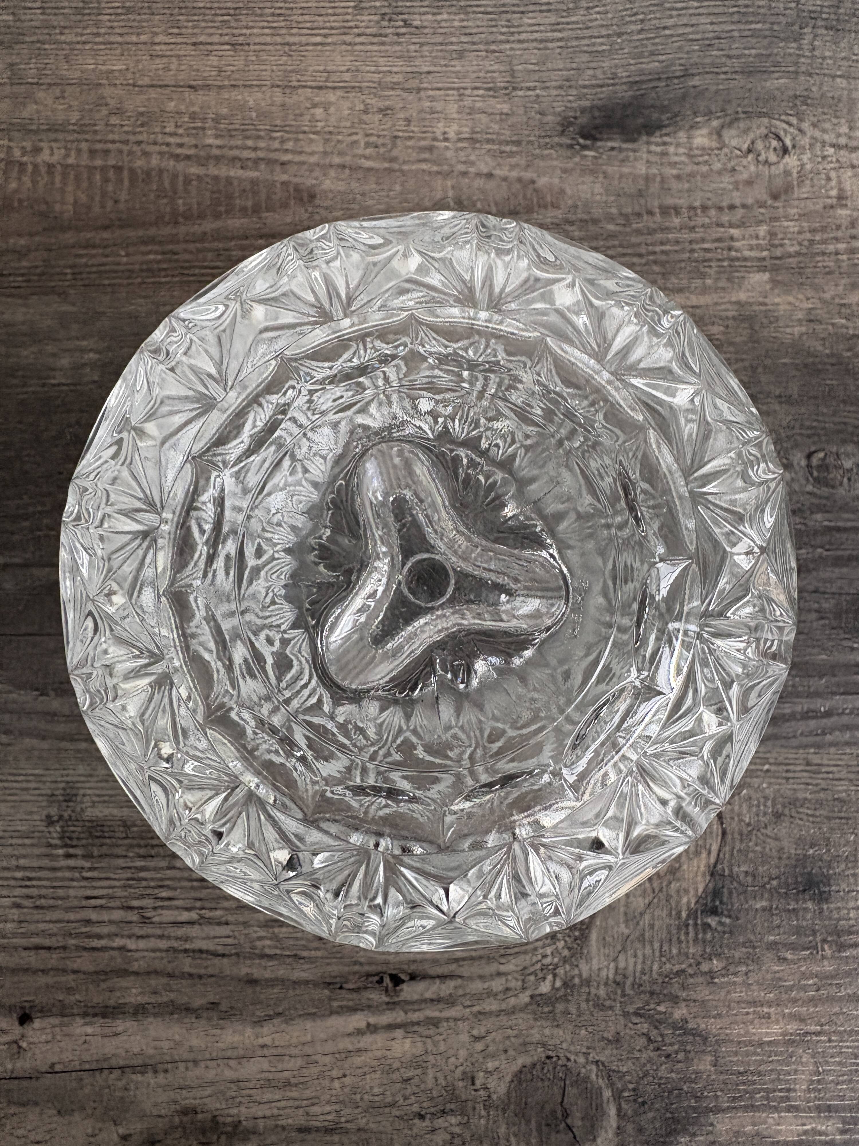 Antique covered jar in chiseled glass