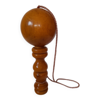 Old varnished wooden cup and ball game