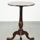 Round antique side/wine table from the late 18th century with a subtle foot