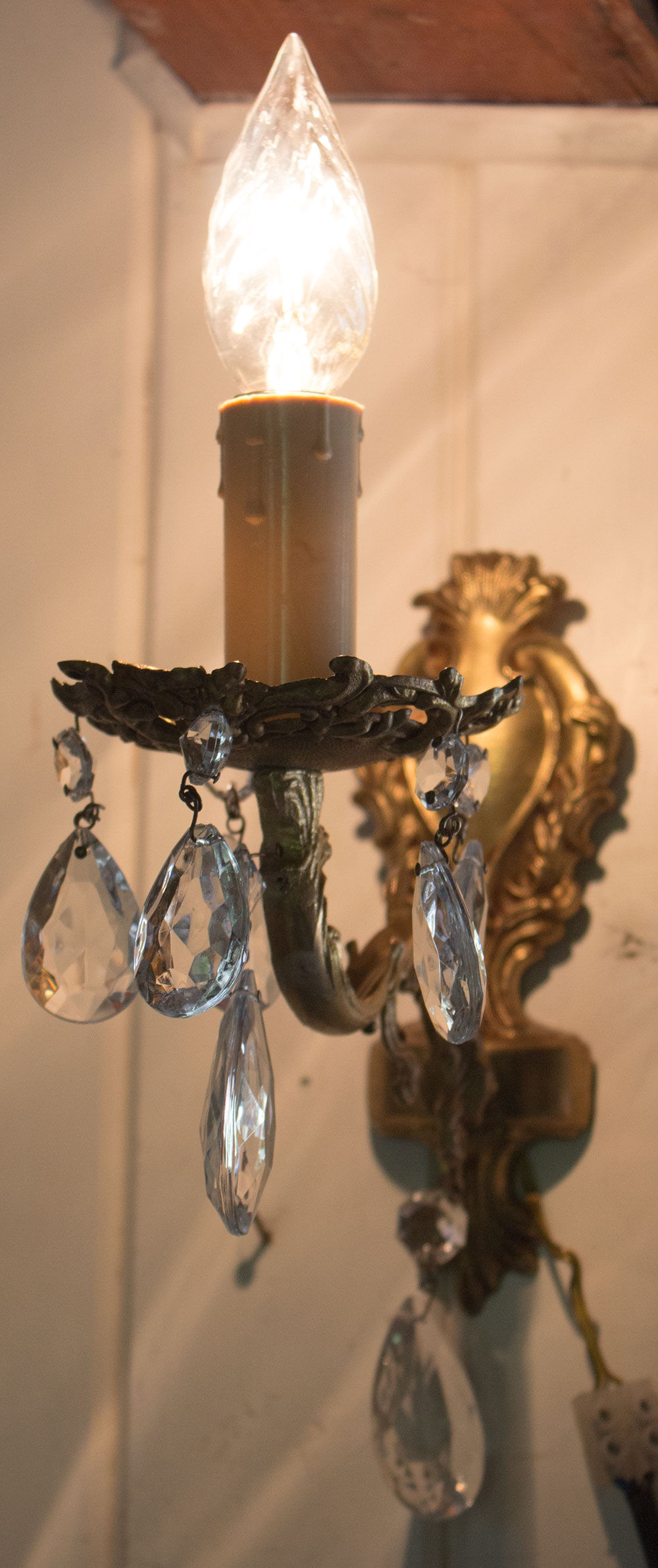 Old brass wall light with glass stamps