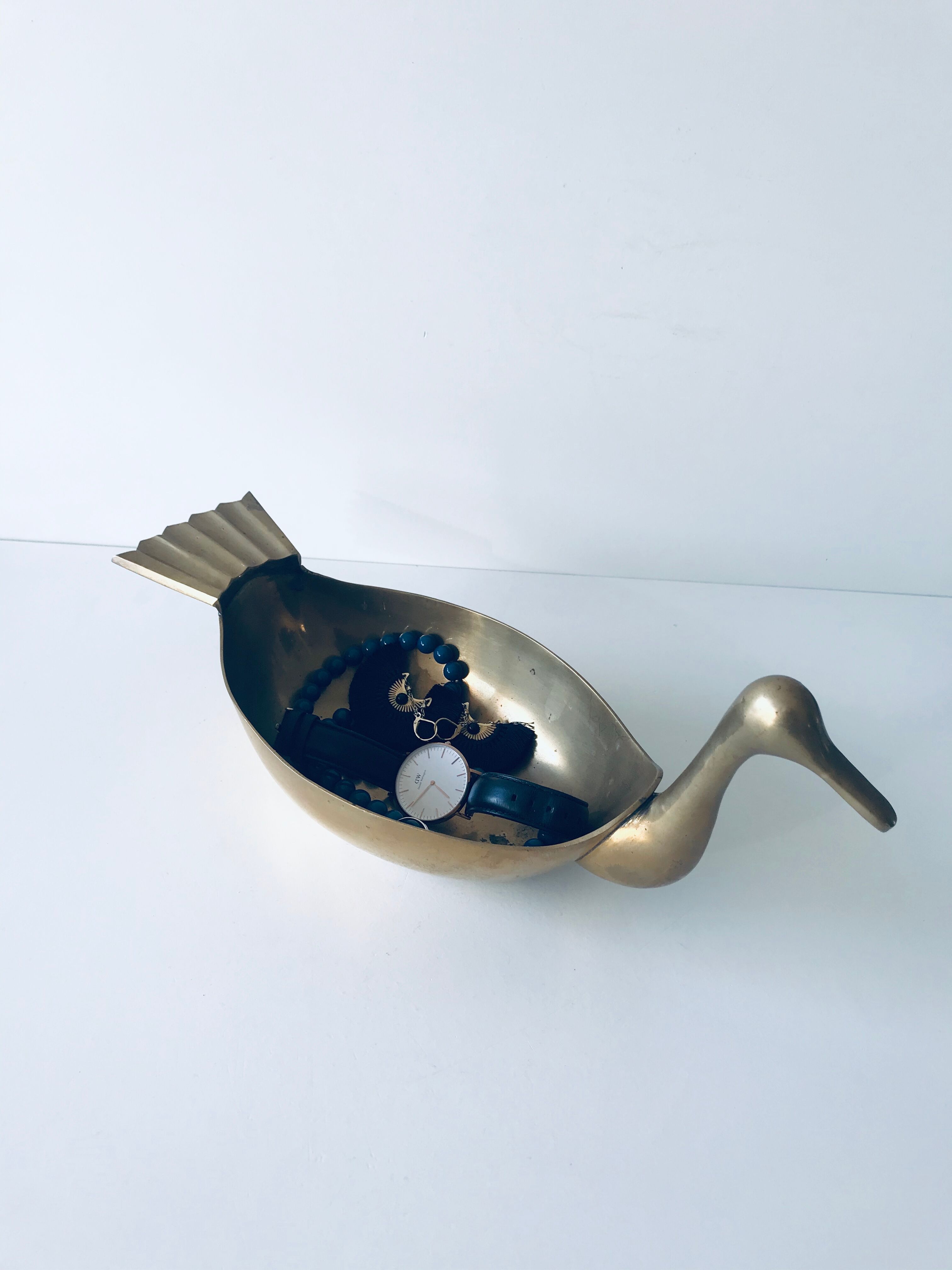 Empty brass duck empty pocket