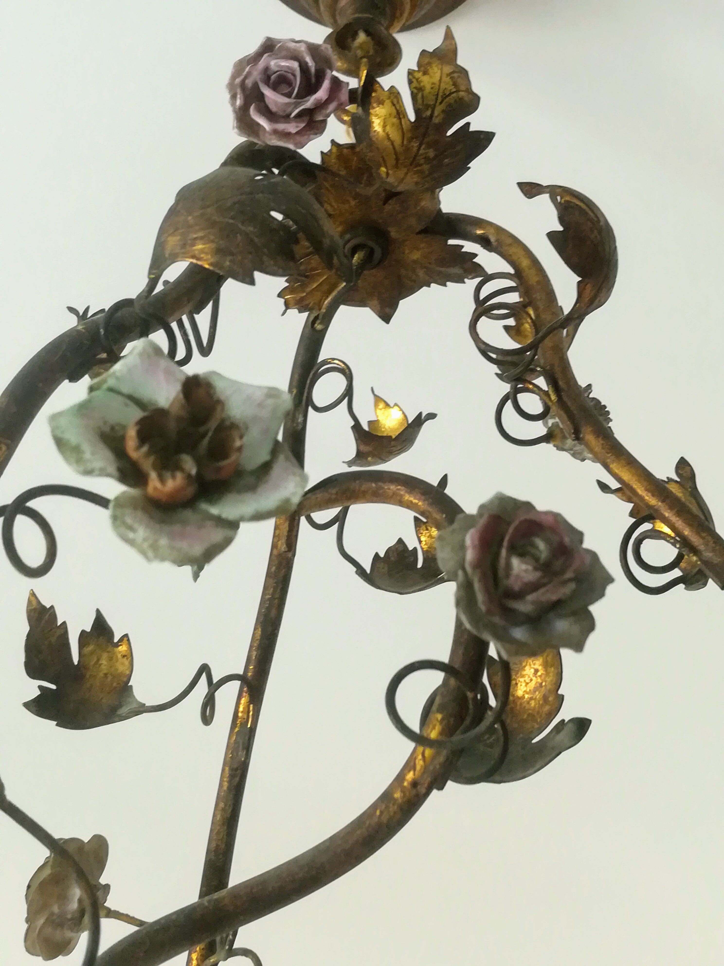 Brass chandelier and porcelain flowers
