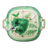 Old square plate in slipware with plant decoration.