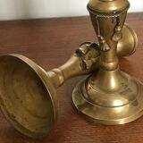 Pair of brass candlesticks with tassels