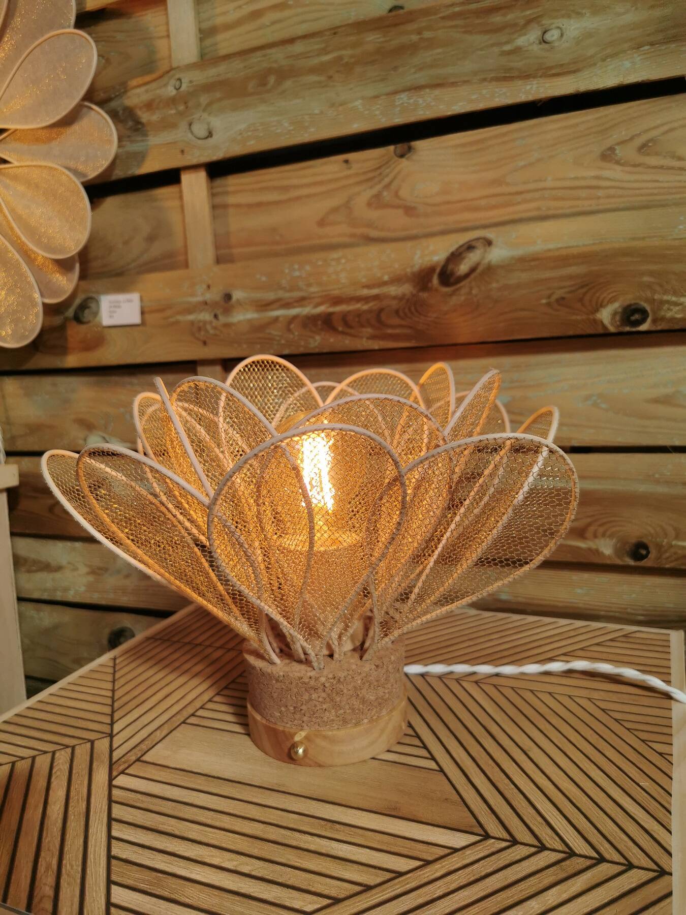 Flower table lamp made of rattan petals and gold mesh