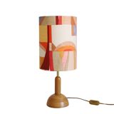 Wooden floor lamp with low printed shade