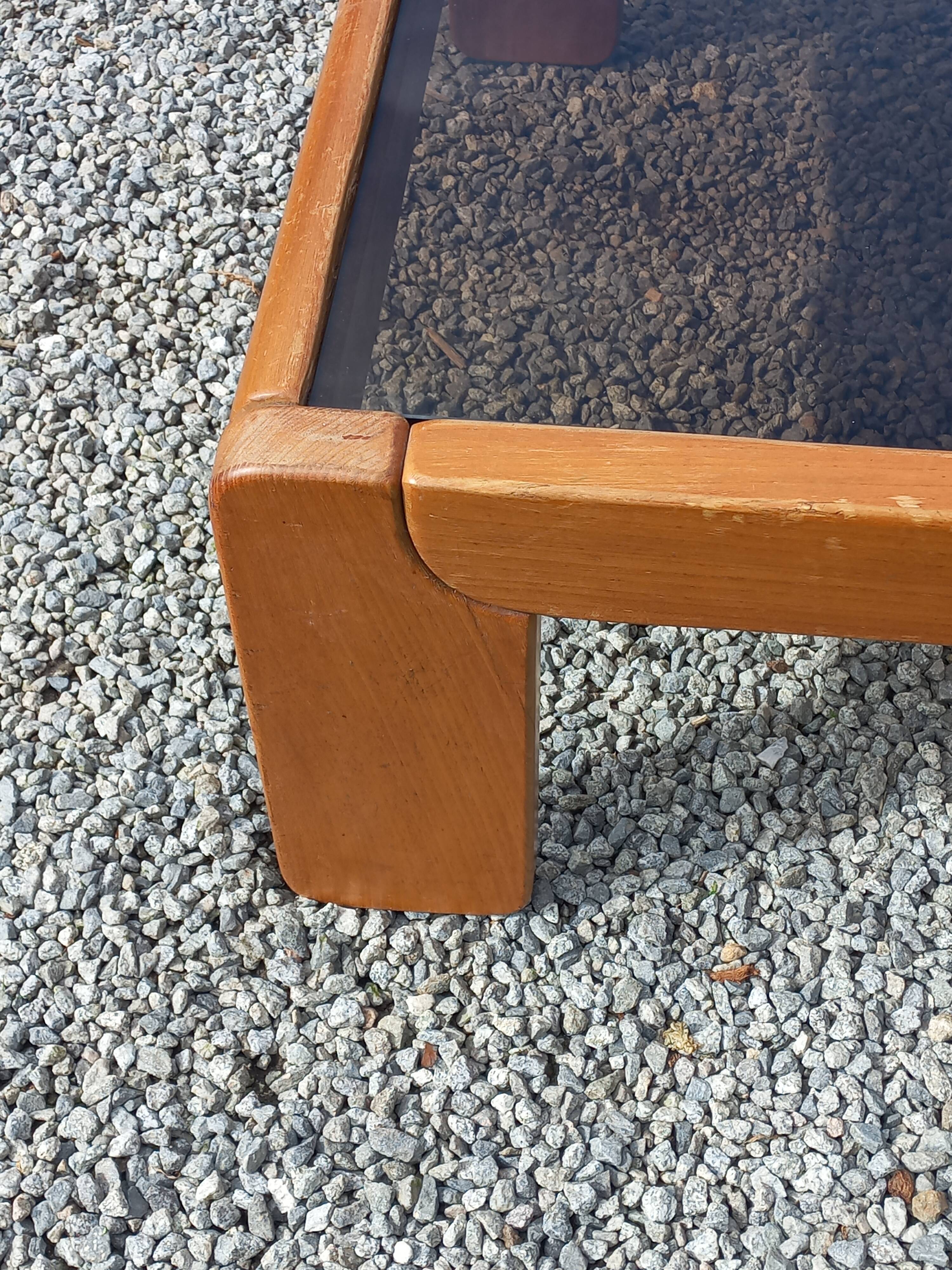 Coffee table from Regain in solid elm with a smoked glass top.