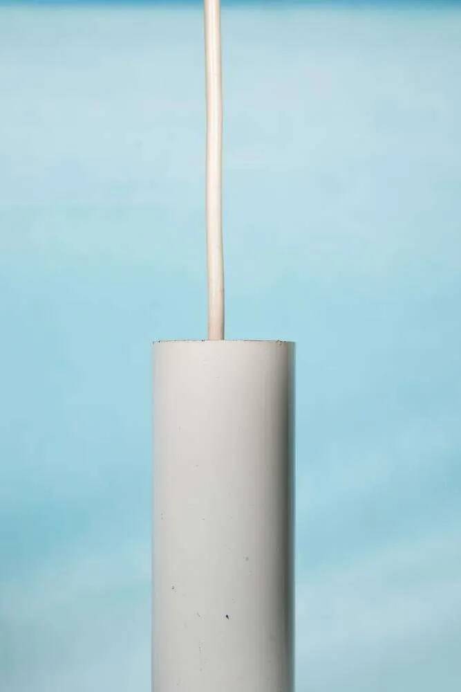 Vintage pendant light design, retro black and white ambient lamp.