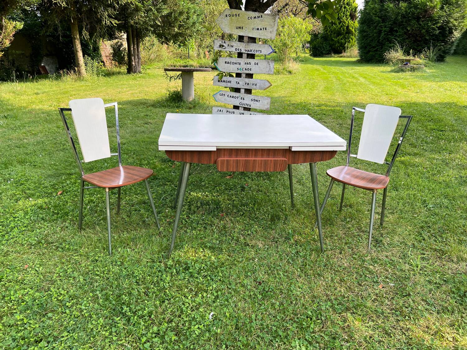 White Formica table with extensions and 2 designer chairs